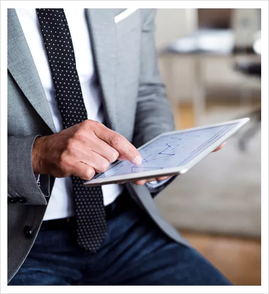 Man using a tablet wearing a suit