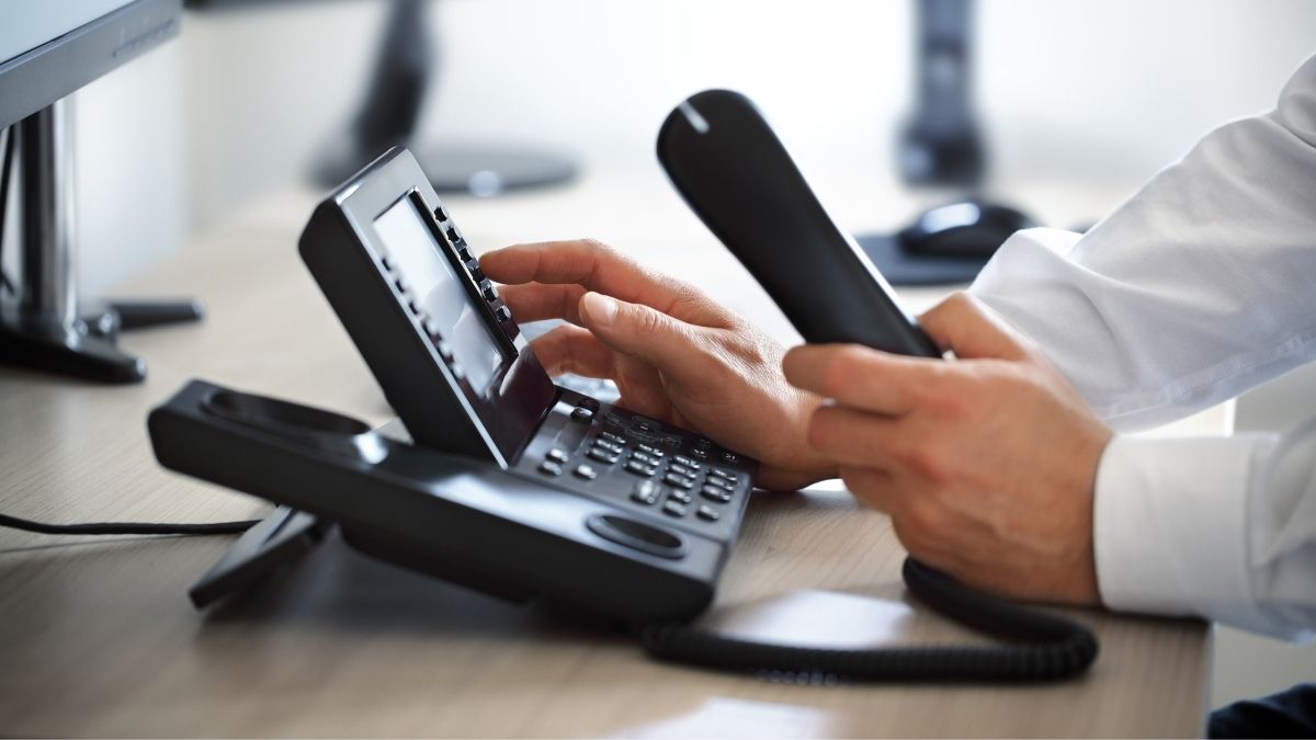 Man using VoIP phone