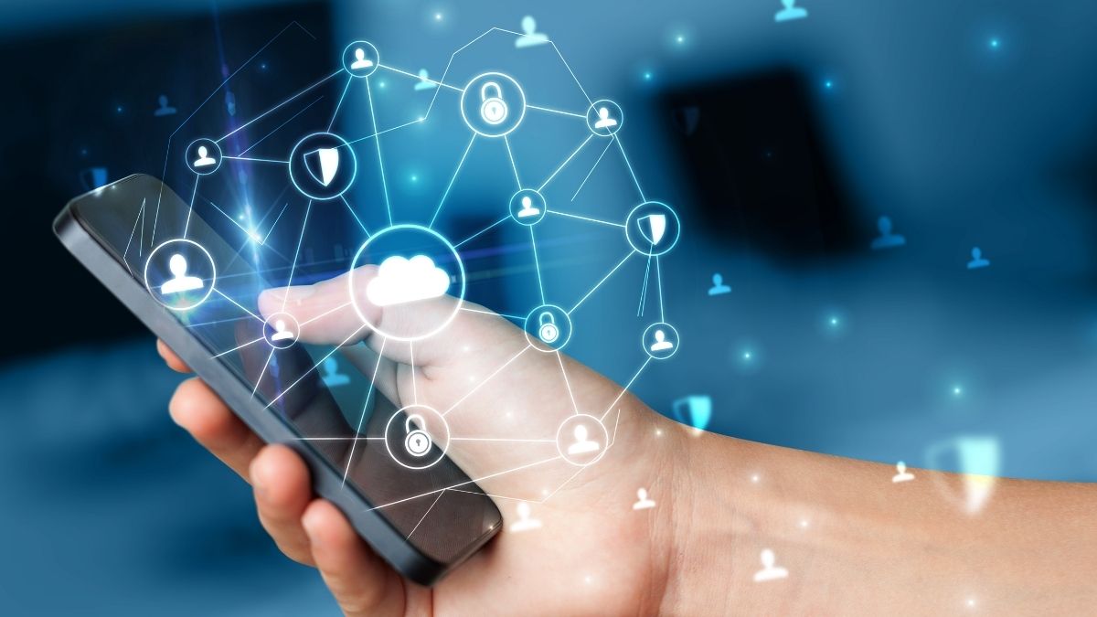 hand using phone with glowing web interface hovering above it