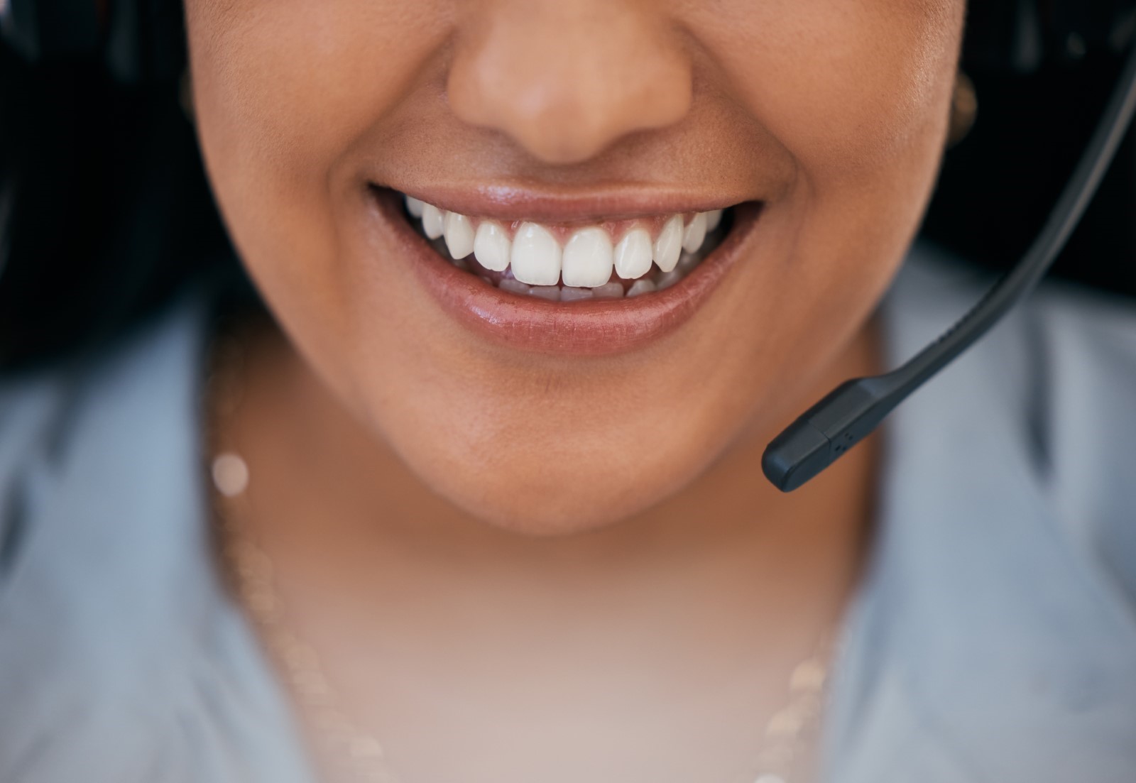 mouth of woman using a business telecoms VoIP headset