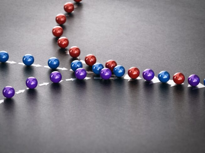 three lines of red, blue, and purple marbles converging into one